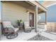 Inviting front porch featuring comfortable seating, perfect for relaxing outdoors at 12794 Tamarac St, Thornton, CO 80602
