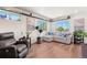 Comfortable living room featuring hardwood floors, ample natural light, and stylish decor at 12794 Tamarac St, Thornton, CO 80602