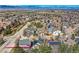 Aerial view of a neighborhood with a view of the mountains and a sunny sky at 10908 Oakshire Ave, Highlands Ranch, CO 80126
