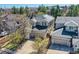 Aerial view of a home featuring solar panels, a three-car garage, and well-maintained landscaping at 10908 Oakshire Ave, Highlands Ranch, CO 80126