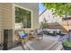 An outdoor seating area with wicker furniture and a stylish rug, perfect for relaxing or entertaining at 10908 Oakshire Ave, Highlands Ranch, CO 80126