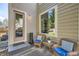 Inviting back porch with comfortable seating, rug, and view of the backyard at 10908 Oakshire Ave, Highlands Ranch, CO 80126
