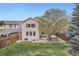 Well-maintained backyard featuring a patio with chairs and a hot tub at 10908 Oakshire Ave, Highlands Ranch, CO 80126