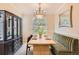 Elegant dining room with a modern chandelier and stylish seating at 10908 Oakshire Ave, Highlands Ranch, CO 80126
