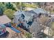 Stylish two-story home showcasing unique architectural details and a well-maintained yard at 10908 Oakshire Ave, Highlands Ranch, CO 80126