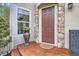 Charming front door with stone accents and a welcoming entrance at 10908 Oakshire Ave, Highlands Ranch, CO 80126