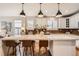 Spacious kitchen island with marble countertop, pendant lighting and modern cabinetry at 10908 Oakshire Ave, Highlands Ranch, CO 80126