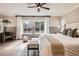 Comfortable main bedroom featuring hardwood floors, recessed lighting, and large windows at 10908 Oakshire Ave, Highlands Ranch, CO 80126