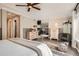 Large primary bedroom with an ensuite bathroom and hardwood floors at 10908 Oakshire Ave, Highlands Ranch, CO 80126