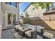 Cozy outdoor patio with comfortable seating, grill, and string lights at 10908 Oakshire Ave, Highlands Ranch, CO 80126