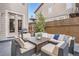 Cozy outdoor patio with comfortable seating, a fire pit table, and a barbecue grill at 10908 Oakshire Ave, Highlands Ranch, CO 80126