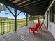 Expansive covered deck offering scenic views, furnished with comfortable seating for outdoor enjoyment at 31756 Buffalo Park Rd, Evergreen, CO 80439