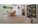 Spacious game room with natural light from the window and a decorative shelving unit at 31756 Buffalo Park Rd, Evergreen, CO 80439