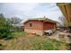 Charming backyard with a brick structure, perfect for outdoor enjoyment and entertaining at 345 Central Ave, Brighton, CO 80601