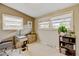 Bedroom featuring ample natural light from three windows, perfect for office space at 345 Central Ave, Brighton, CO 80601