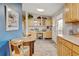 Eat-in kitchen has a dining area, built-in desk, and lots of storage with counter space at 345 Central Ave, Brighton, CO 80601