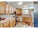 Inviting kitchen with wood cabinets, stainless appliances, and lots of counter space at 345 Central Ave, Brighton, CO 80601