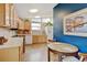 Charming kitchen with wood cabinets, natural light, and a cozy breakfast nook at 345 Central Ave, Brighton, CO 80601