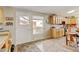 Bright eat-in kitchen featuring ample storage with built in appliances, all with outside access at 345 Central Ave, Brighton, CO 80601