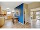 Open kitchen and dining area featuring stainless appliances and a blue accent wall at 345 Central Ave, Brighton, CO 80601
