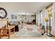Bright living room with hardwood floors, a decorative rug and built-in shelving at 345 Central Ave, Brighton, CO 80601