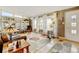 Inviting living room with hardwood floors, large windows, and stylish decor at 345 Central Ave, Brighton, CO 80601