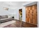 Basement living area with wood-look floor and laundry area at 7131 Raritan St, Denver, CO 80221