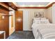 Bedroom featuring carpet and dark built-in shelving at 7131 Raritan St, Denver, CO 80221