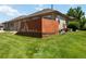 Green backyard with a patio and wood fence, offering privacy and outdoor living space at 16141 W 64Th Way, Arvada, CO 80007