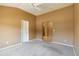Spacious bedroom with neutral walls, plush carpet, and a ceiling fan providing a comfortable atmosphere at 16141 W 64Th Way, Arvada, CO 80007