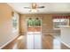 Bright dining area with hardwood floors and sliding door access to the patio at 16141 W 64Th Way, Arvada, CO 80007