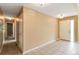 Inviting foyer featuring neutral paint, tile flooring, and hallway access at 16141 W 64Th Way, Arvada, CO 80007