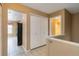Hallway with view of the kitchen, closet, and bathroom at 16141 W 64Th Way, Arvada, CO 80007