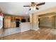 Open-concept kitchen with light wood cabinets, black appliances, and views of living room at 16141 W 64Th Way, Arvada, CO 80007