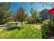 A spacious backyard with a playhouse and lush green lawn at 19099 E Creekside Dr, Parker, CO 80134
