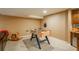 Basement area featuring a foosball table, a rocking horse, and carpeted flooring at 19099 E Creekside Dr, Parker, CO 80134
