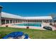 Large community swimming pool surrounded by a deck and potted plants at 19099 E Creekside Dr, Parker, CO 80134