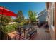 Enjoy outdoor living on this spacious deck, complete with dining area, grill, and a view of the backyard at 19099 E Creekside Dr, Parker, CO 80134