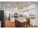 Modern kitchen with a center island, stainless steel appliances, and granite countertops, ideal for cooking and entertaining at 19099 E Creekside Dr, Parker, CO 80134