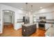 Spacious kitchen with an island, stainless steel appliances, and granite countertops, offering ample space and modern amenities at 19099 E Creekside Dr, Parker, CO 80134