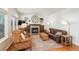 Comfortable living room with a fireplace and built-in shelving, offering a relaxing and inviting atmosphere for gatherings at 19099 E Creekside Dr, Parker, CO 80134