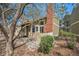 Charming townhome exterior features a brick chimney and welcoming front entrance and rock garden at 2005 S Helena St # G, Aurora, CO 80013