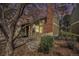 Charming townhome exterior features a brick chimney and welcoming front entrance and rock garden at 2005 S Helena St # G, Aurora, CO 80013