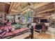 Basement view showcasing the wood lattice ceiling, cozy living area, and potential for versatile use at 17675 E Girard Ave, Aurora, CO 80013