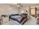 Bedroom with mirrored closet, neutral walls, and a ceiling fan providing comfort at 17675 E Girard Ave, Aurora, CO 80013