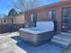 Outdoor patio featuring a luxurious hot tub, perfect for relaxation and entertainment at 17675 E Girard Ave, Aurora, CO 80013