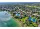 A scenic aerial view of the community's pool, tennis courts, lake, and lush green surroundings at 6790 W Crestline Ave, Littleton, CO 80123