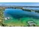 Expansive aerial view of the lake, featuring turquoise water and docks with boat slips at 6790 W Crestline Ave, Littleton, CO 80123