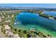 Breathtaking aerial of community lake featuring docks, boats, and waterfront homes at 6790 W Crestline Ave, Littleton, CO 80123