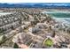 Breathtaking aerial view of a residential area with a lake, mountains, and a neighborhood at 6790 W Crestline Ave, Littleton, CO 80123